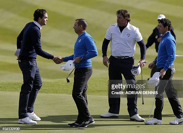 Team Europe's Sergio Garcia of Spain and Rory McIlroy of Northern Ireland congratulate Phil Mickelson of Team US and Keegan Bradley of Team US, after...