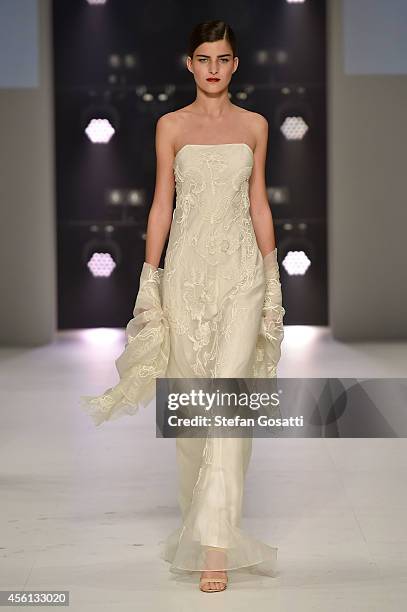 Model showcases designs by Akira during the Red Carpet runway show at Mercedes-Benz Fashion Festival Sydney at Sydney Town Hall on September 26, 2014...