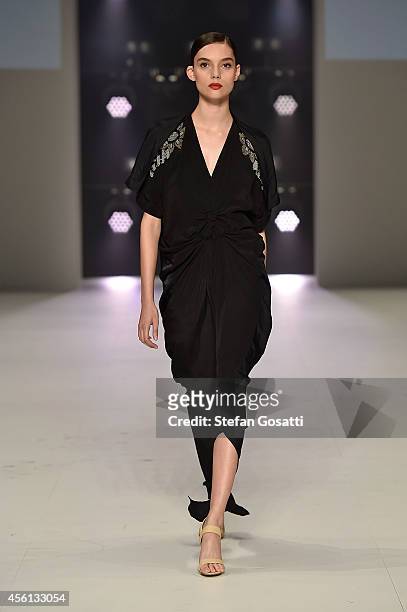 Model showcases designs by Akira during the Red Carpet runway show at Mercedes-Benz Fashion Festival Sydney at Sydney Town Hall on September 26, 2014...