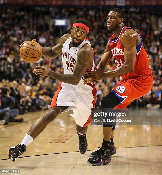 Toronto Raptors small forward John Salmons heads for the hoop past Philadelphia 76ers power forward Thaddeus Young late in the game as theToronto...