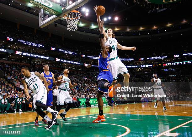 Kelly Olynyk of the Boston Celtics blocks the shot of Iman Shumpert of the New York Knicks in the fourth quarter during the game at TD Garden on...