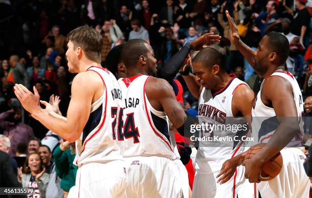 Al Horford of the Atlanta Hawks reacts after hitting the game-winning basket in a 101-99 overtime win over the Washington Wizards at Philips Arena on...