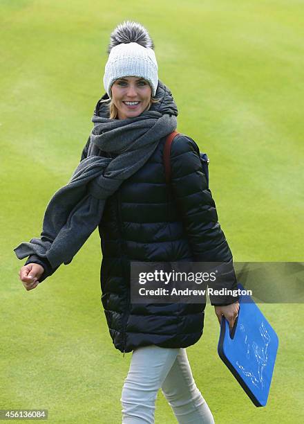 Katharina Boehm, partner of Sergio Garcia of Europe smiles during the Morning Fourballs of the 2014 Ryder Cup on the PGA Centenary course at the...