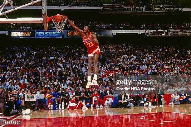 Eastern Conference All-Star Dominique Wilkins of the Atlanta Hawks dunks during the Slam Dunk Contest during the 1988 NBA All-Star Game on February...