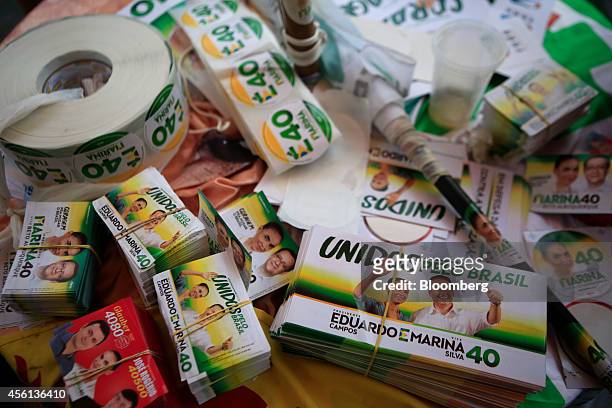 Campaign stickers and other materials sit on a table during a campaign rally for Brazilian presidential candidate Marina Silva of the Brazilian...