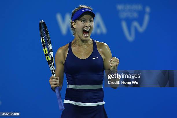 Eugenie Bouchard of Canada celebrates after won the match against Caroline Wozniacki of Denmark on day six of 2014 Dongfeng Motor Wuhan Open at...