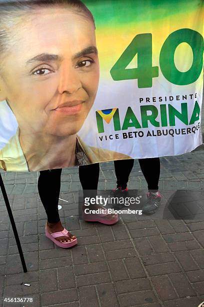 Supporters stand behind a flag during a campaign rally for Brazilian presidential candidate Marina Silva of the Brazilian Socialist Party in Duque de...