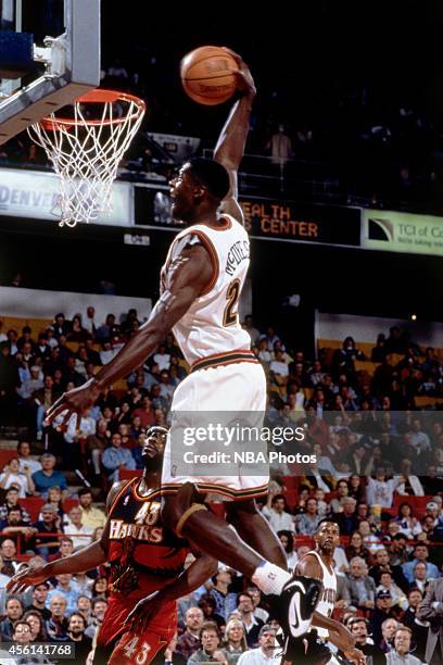 Antonio McDyess of the Denver Nuggets drives to the basket against the Atlanta Hawks during the 1996 season at the Pepsi Center in Denver, Colorado....