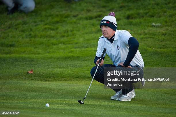 Hunter Mahan of the United States reads his putt during the foursome matches for the 40th Ryder Cup at Gleneagles, on September 26, 2014 in...