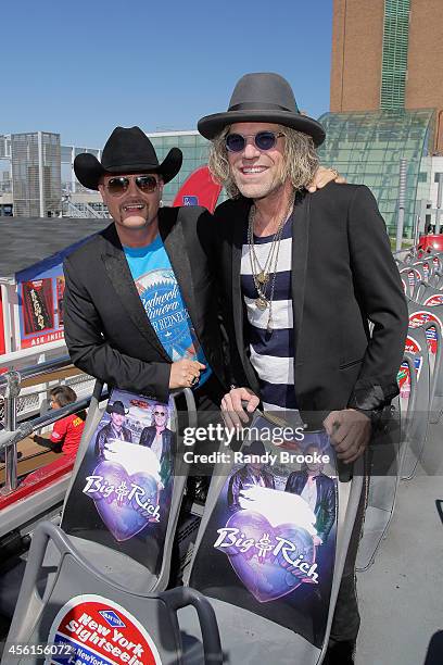 John Rich and Big Kenny unveil their seats aboard the " Ride of Fame" at Pier 78 on September 26, 2014 in New York City.