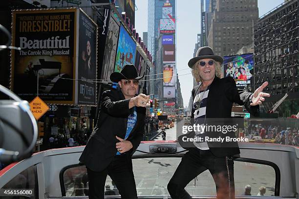 The Big & Rich duo, John Rich and Big Kenny greet Times Square aboard the Ride of Fame at Pier 78 on September 26, 2014 in New York City.