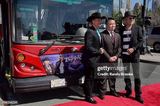 John Rich and Big Kenny pose with the Ride of Fame Creator and Producer David W. Chien at Pier 78 on September 26, 2014 in New York City.