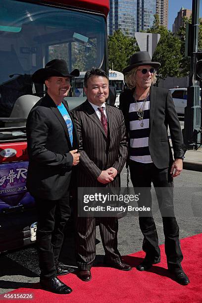 John Rich and Big Kenny pose with the Ride of Fame Creator and Producer David W. Chien at Pier 78 on September 26, 2014 in New York City.