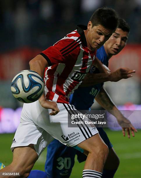 Guido Carrillo, of Estudiantes, and Facundo Cardozo, of Velez Sarsfield, go for the ball during a match between Estudiantes and Velez Sarsfield as...