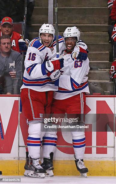 Derick Brassard and Anthony Duclair of the New York Rangers celebrate Duclair's goal in the first period against the Chicago Blackhakws during a...