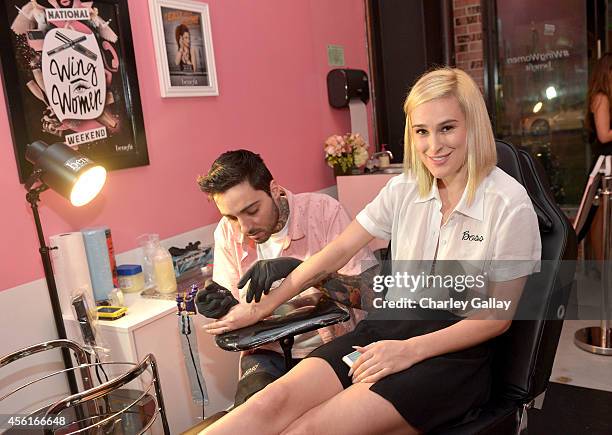 Actress Rumer Willis gets tattooed by artist Romeo Lacoste during Benefit Cosmetics and Vanessa Hudgens Kick-Off National Wing Women Weekend at Space...