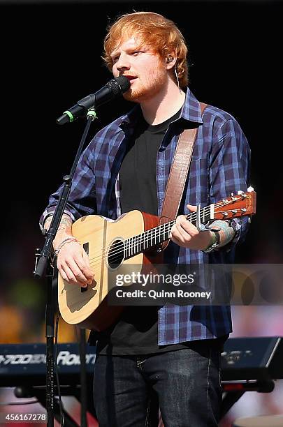 Ed Sheeran performs during the 2014 AFL Grand Final match between the Sydney Swans and the Hawthorn Hawks at Melbourne Cricket Ground on September...