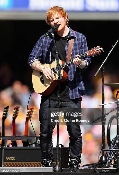 Ed Sheeran performs during the 2014 AFL Grand Final match between the Sydney Swans and the Hawthorn Hawks at Melbourne Cricket Ground on September...