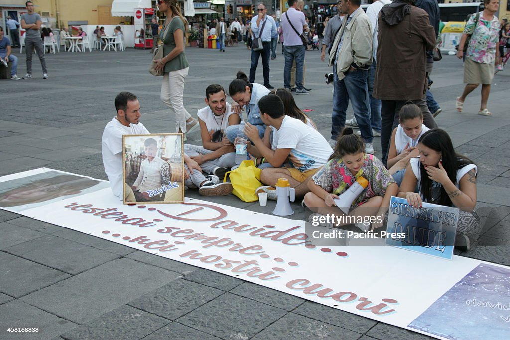 Hundreds of supporters gathered at Piazza Dante with banners...