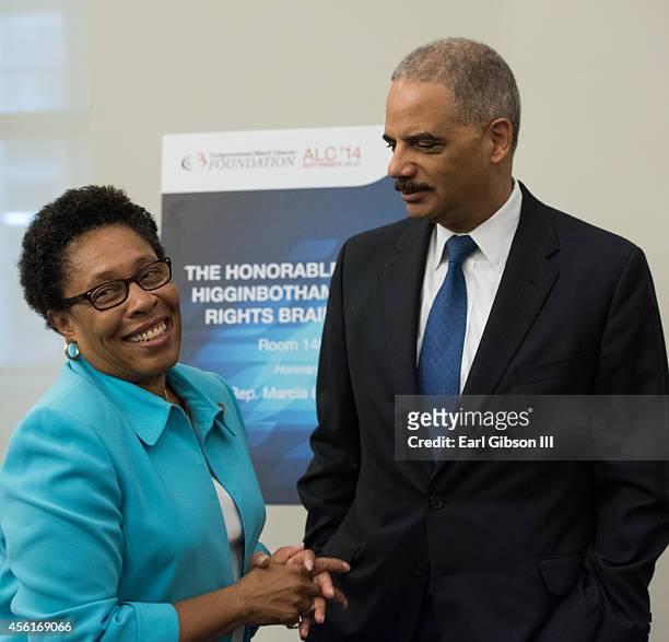 Representative Marcia Fudge and Attorney General Eric Holder pose for a photo at the Congressional Black Caucus Foundation Inc. 44th Annual...