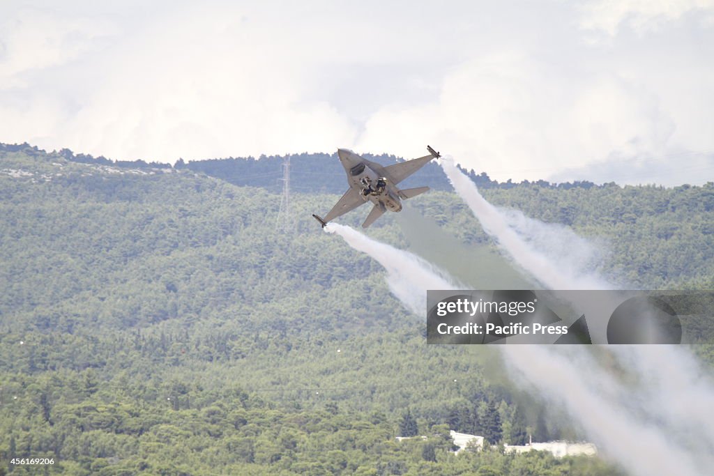 A F-16AM from the Royal Netherlands Air Force creates vapor...