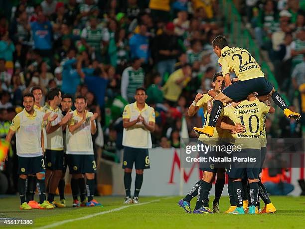 Miguel Layun celebrates with teammates after scoring the second goal of the match during a match between Santos Laguna and America as part of 10th...