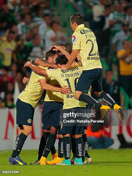 Miguel Layun celebrates with teammates after scoring the second goal of the match during a match between Santos Laguna and America as part of 10th...