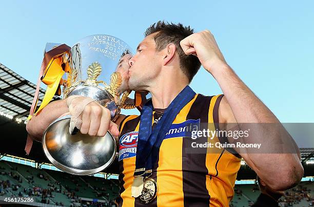 Luke Hodge of the Hawks kisses the Premeirship Cup during the 2014 AFL Grand Final match between the Sydney Swans and the Hawthorn Hawks at Melbourne...