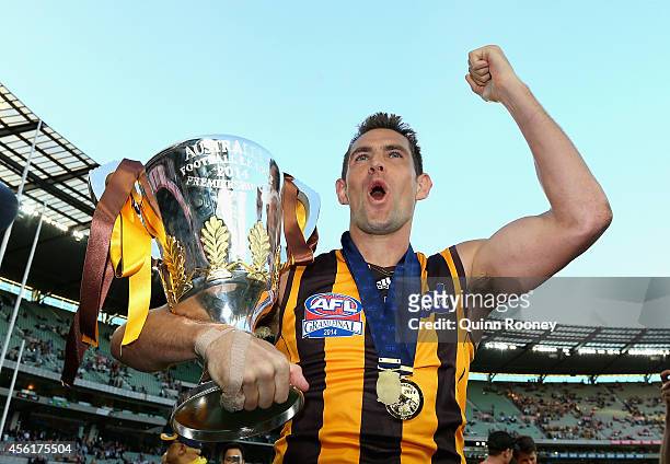 Luke Hodge of the Hawks kisses the Premeirship Cup during the 2014 AFL Grand Final match between the Sydney Swans and the Hawthorn Hawks at Melbourne...