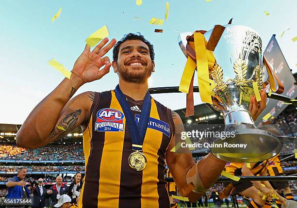 Cyril Rioli of the Hawks celebrates with the Premeirship Cup during the 2014 AFL Grand Final match between the Sydney Swans and the Hawthorn Hawks at...