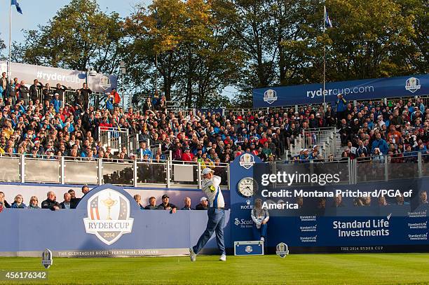 Rory McIlroy of Northern Ireland hits his tee shot on the first tee during the fourball matches for the 40th Ryder Cup at Gleneagles, on September...