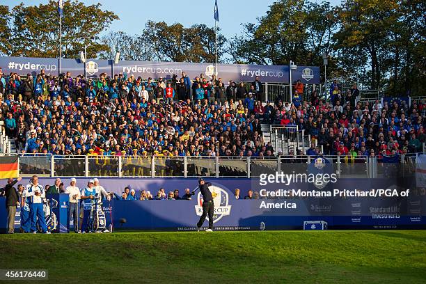 Hunter Mahan of the United States watches his tee shot on the first tee during the fourball matches for the 40th Ryder Cup at Gleneagles, on...