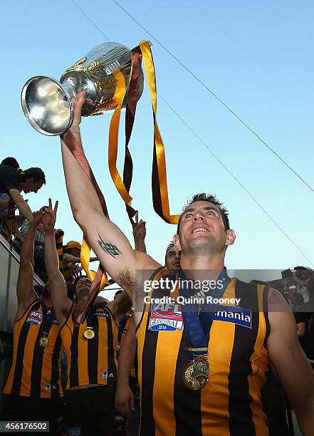 Luke Hodge of the Hawks holds up the Premeirship Cup during the 2014 AFL Grand Final match between the Sydney Swans and the Hawthorn Hawks at...