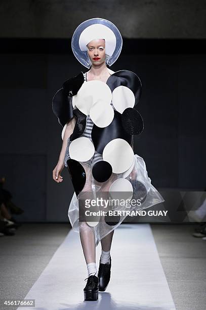 Model presents a creation by Junya Watanabe during the 2015 Spring/Summer ready-to-wear collection fashion show, on September 27, 2014 in Paris. AFP...