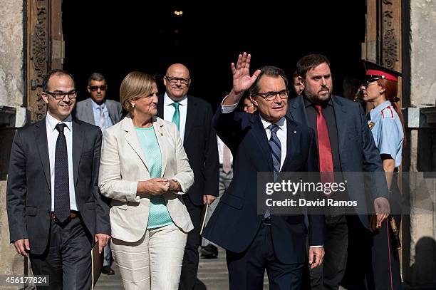 President of Catalonia Artur Mas waves as he leaves the Palau de la Generalitat, the Catalan government building, next to Spokesman of the...