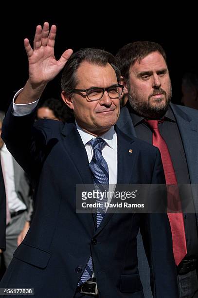 President of Catalonia Artur Mas waves as he leaves the Palau de la Generalitat, the Catalan government building, next to the Leader of the...