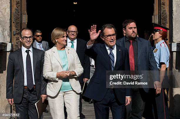 President of Catalonia Artur Mas waves as he leaves the Palau de la Generalitat, the Catalan government building, next to Spokesman of the...