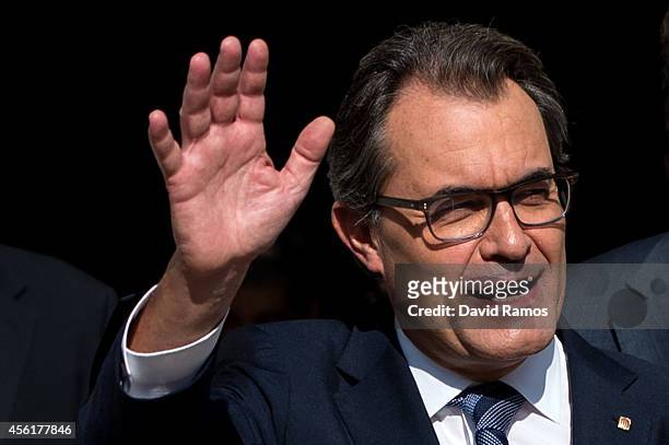 President of Catalonia Artur Mas waves as he leaves the Palau de la Generalitat, the Catalan government building, on September 27, 2014 in Barcelona,...