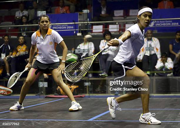 Nicol David of Malaysia and Rebecca Palllikal Dipika of India competes during Squash Womens Team Final during day eight of the 2014 Asian Games at...