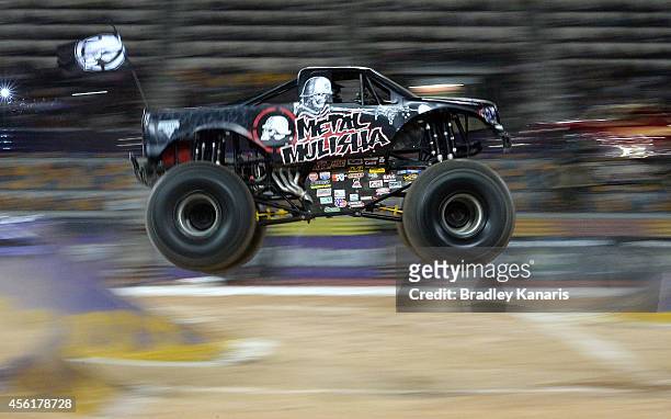 Todd Leduc representing Metal Mulisha goes over the jump during Monster Jam at Queensland Sport and Athletics Centre on September 27, 2014 in...