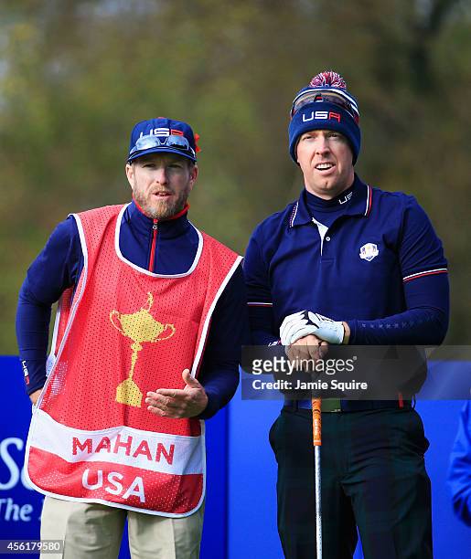 Hunter Mahan of the United States talks caddie John Wood on the seventh tee during the Morning Fourballs of the 2014 Ryder Cup on the PGA Centenary...