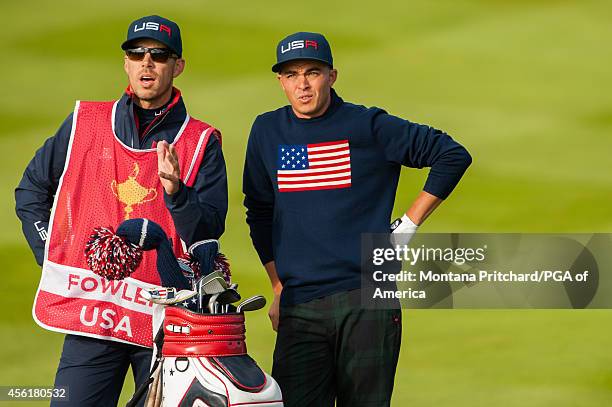 Rickie Fowler of the United States stands with his caddie during the fourball matches for the 40th Ryder Cup at Gleneagles, on September 27, 2014 in...