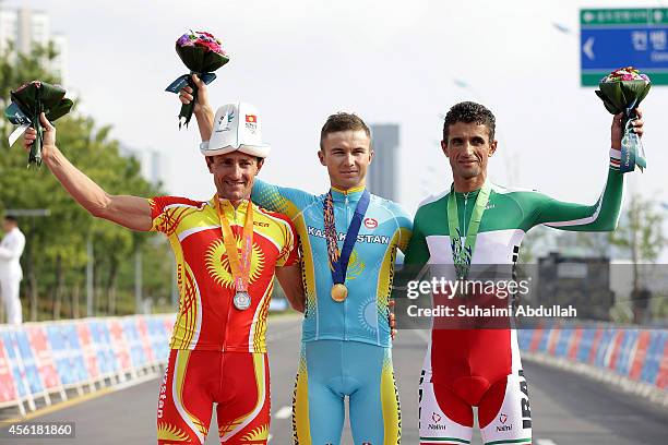 Silver medallist, Evgenii Vakker of Krygyzstan, gold medallist, Alexey Lutsenko of Kazakhstan and bronze medallist, Hossein Askari of Iran pose for a...
