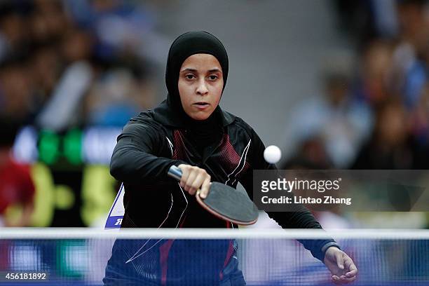 Maryam S B A Abdulraheem of Kuwait competing against Kim Jong of North Korea in Table Tennis Women's Team Preliminary Round Group D during day eight...