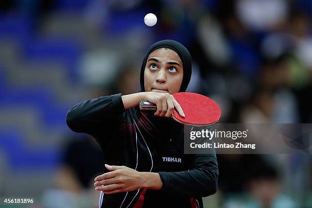 Maryam S B A Abdulraheem of Kuwait competing against Kim Jong of North Korea in Table Tennis Women's Team Preliminary Round Group D during day eight...