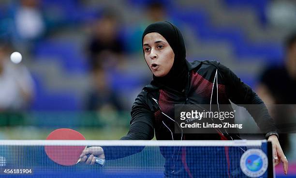 Maryam S B A Abdulraheem of Kuwait competing against Kim Jong of North Korea in Table Tennis Women's Team Preliminary Round Group D during day eight...