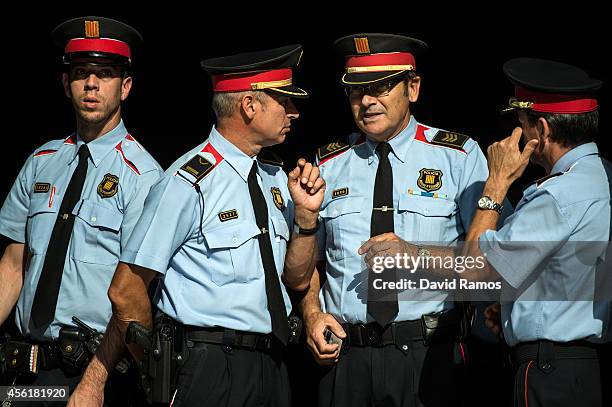 Mosso d'Esquadra officer, the Catalan Police, are seen at the main entrance of the Palau de la Generalitat, the Catalan government building, on...