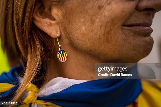 Woman wears a Pro-Independence earring as she demonstrate in front of the Generalitat de Catalunya, the Catalonia's Government building on September...