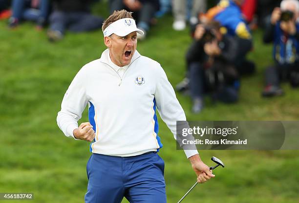 Ian Poulter of Europe celebrates his birdie on the 16th hole during the Morning Fourballs of the 2014 Ryder Cup on the PGA Centenary course at the...