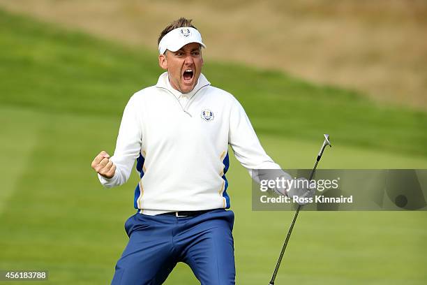 Ian Poulter of Europe celebrates chipping in on the 15th hole during the Morning Fourballs of the 2014 Ryder Cup on the PGA Centenary course at the...